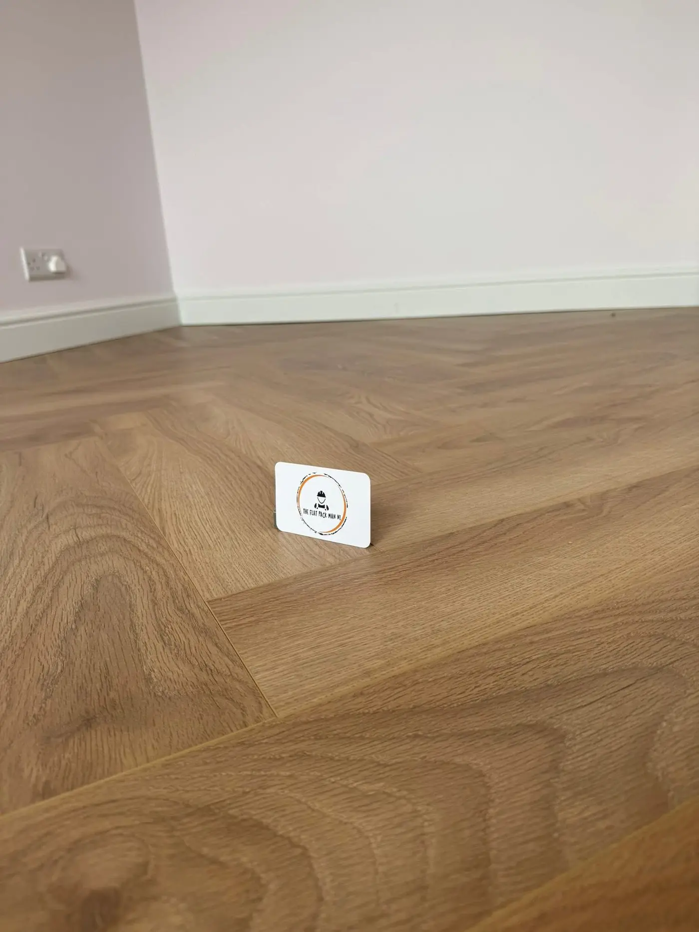 Laminate flooring samples displayed alongside wall panelling options