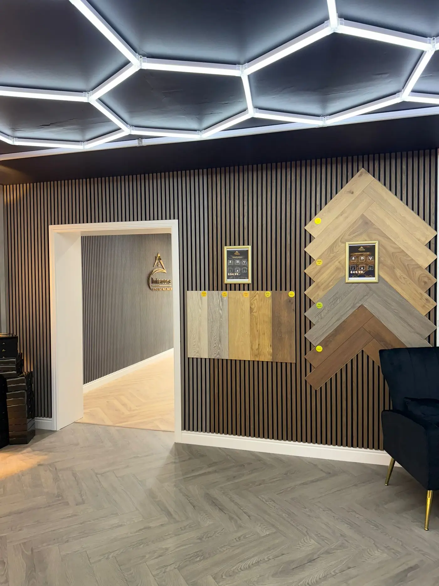 Laminate flooring samples displayed alongside wall panelling options
