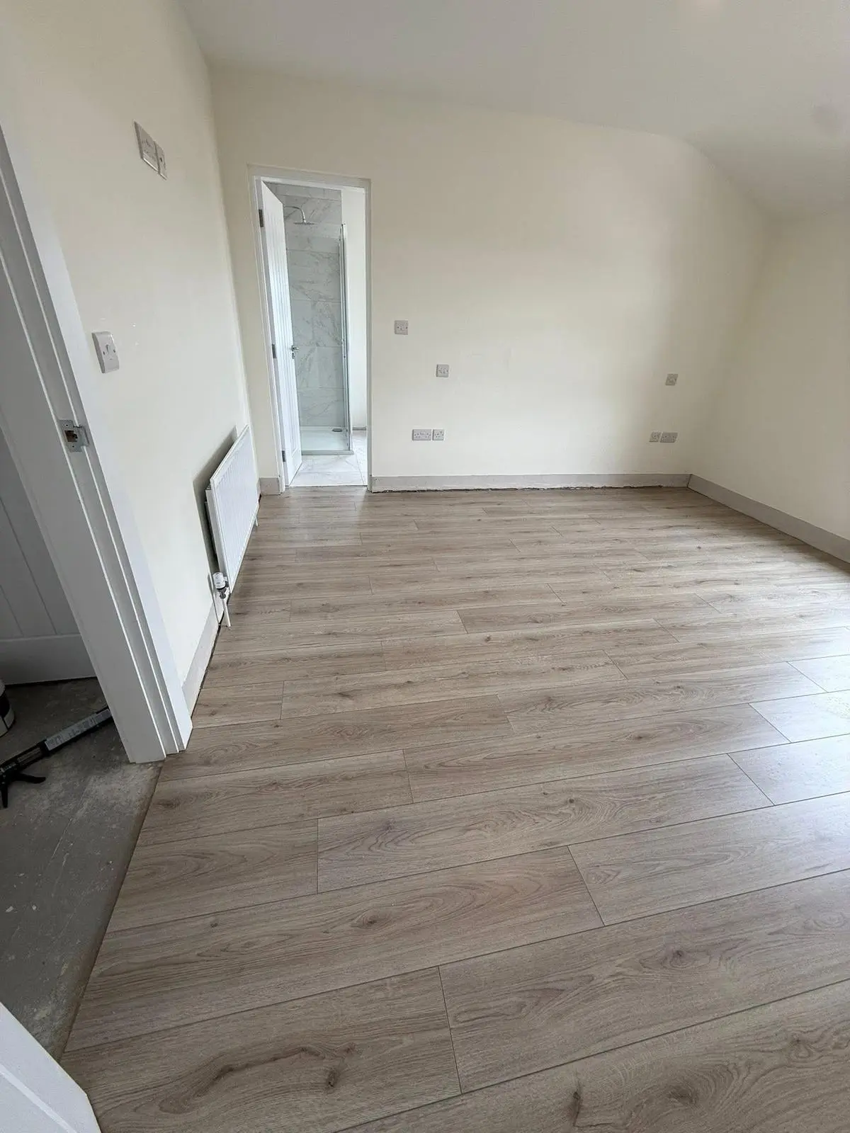 Close-up of modern laminate flooring installation in Northern Ireland home