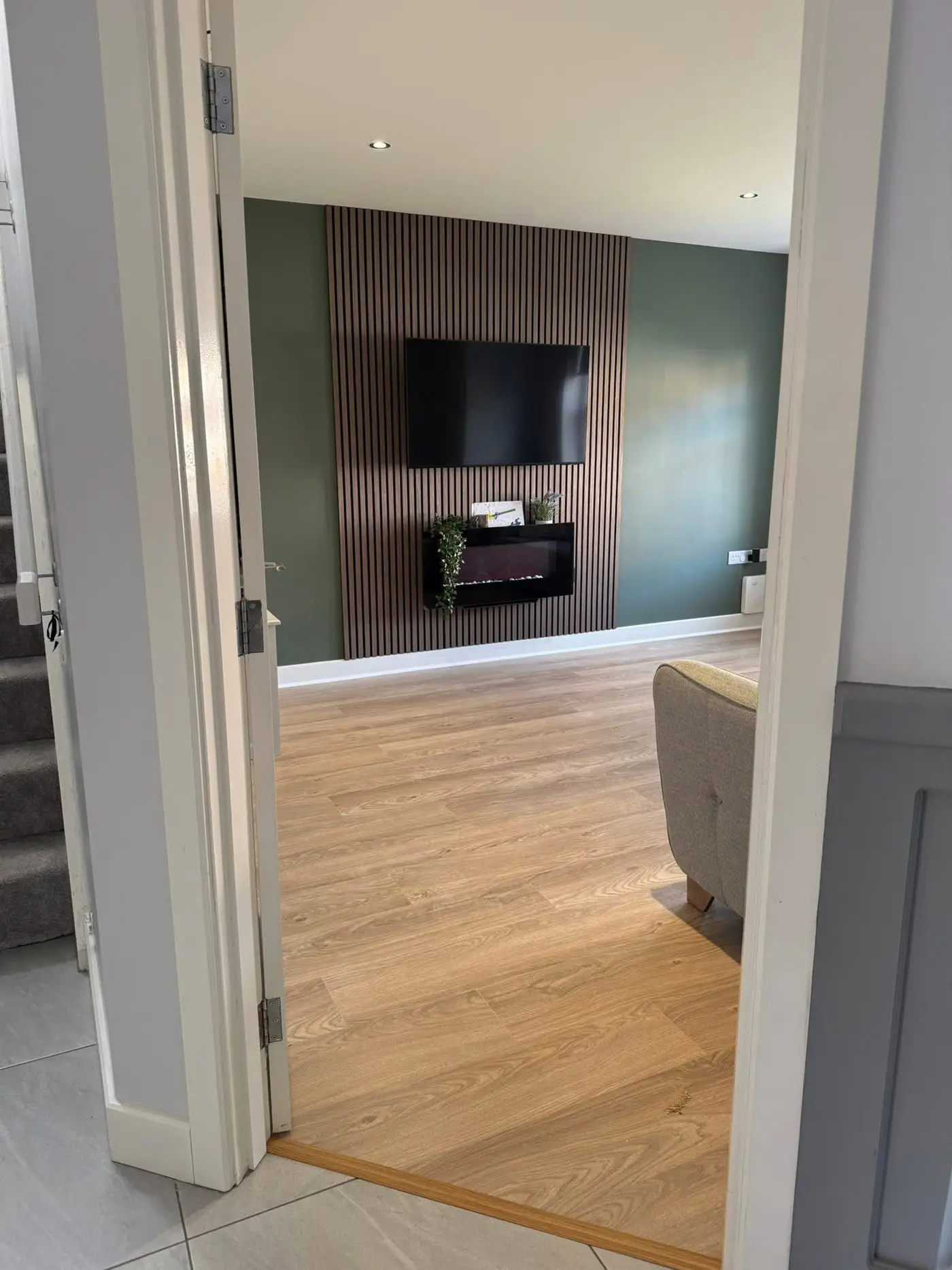 Laminate flooring samples displayed alongside wall panelling options