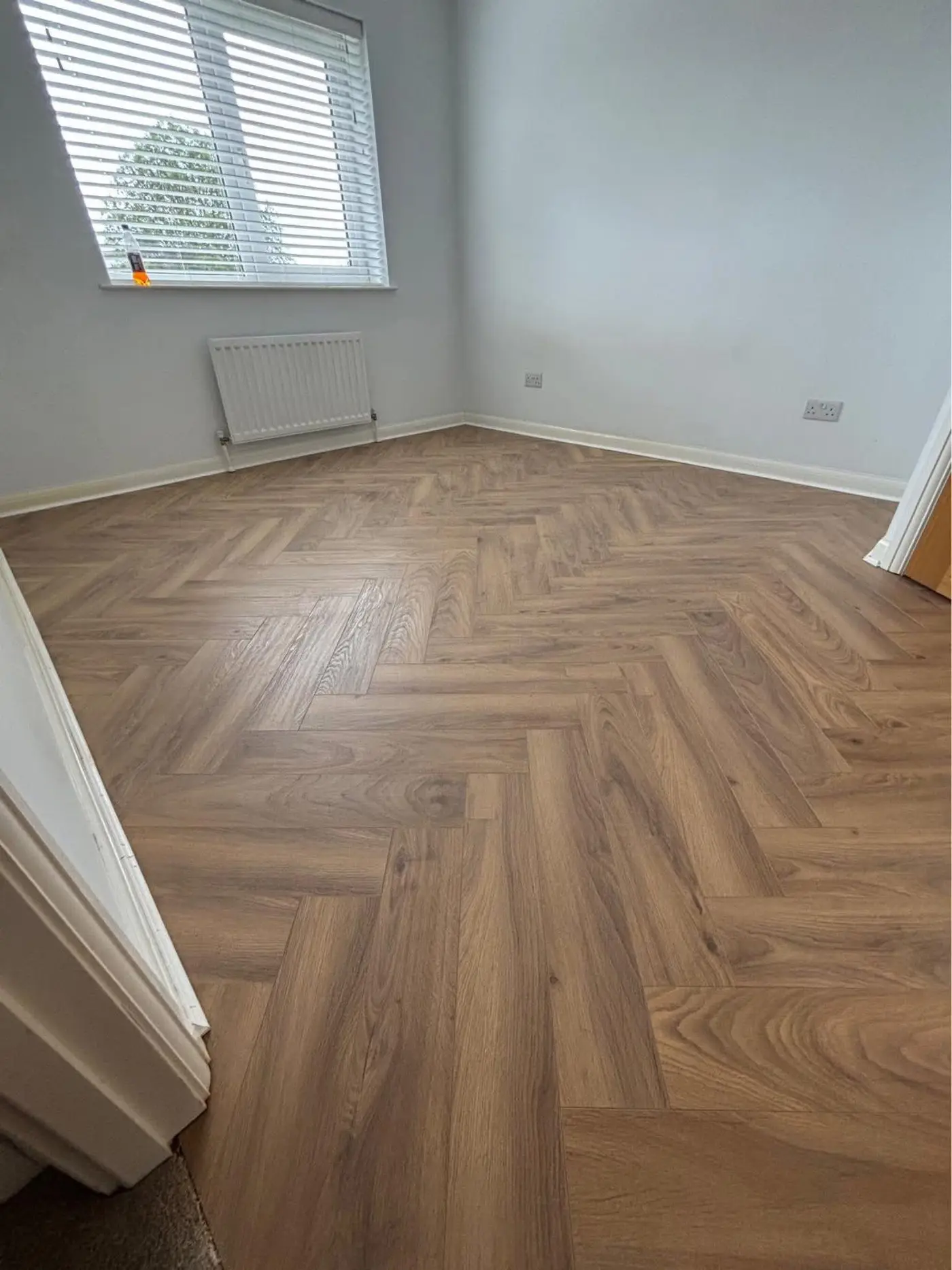 Close-up of modern laminate flooring installation in Northern Ireland home