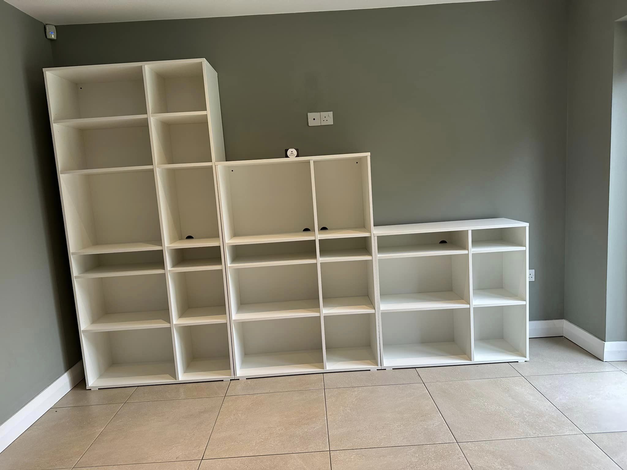 White book shelves in kitchen
